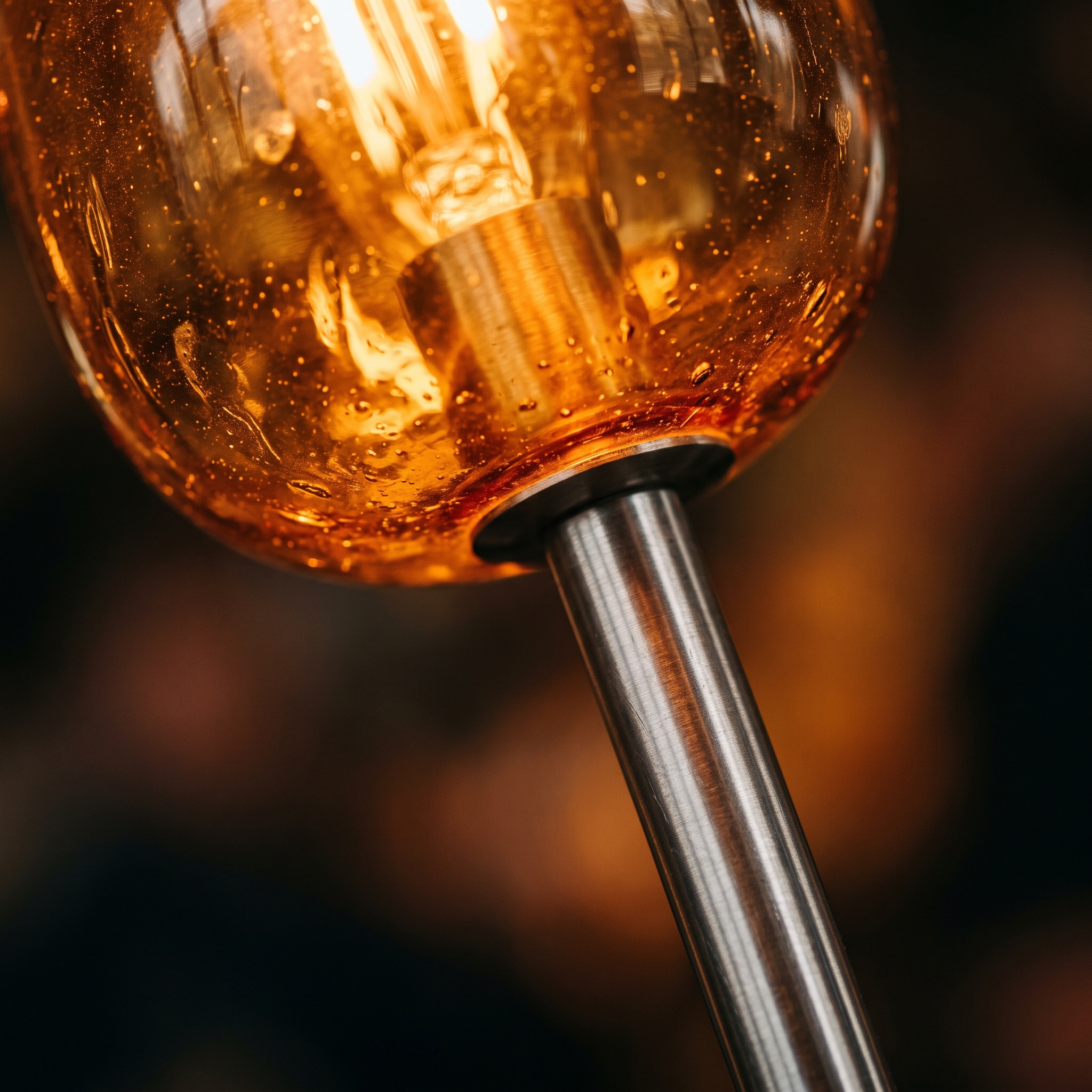 Close-up of glass and metal materials in warm light